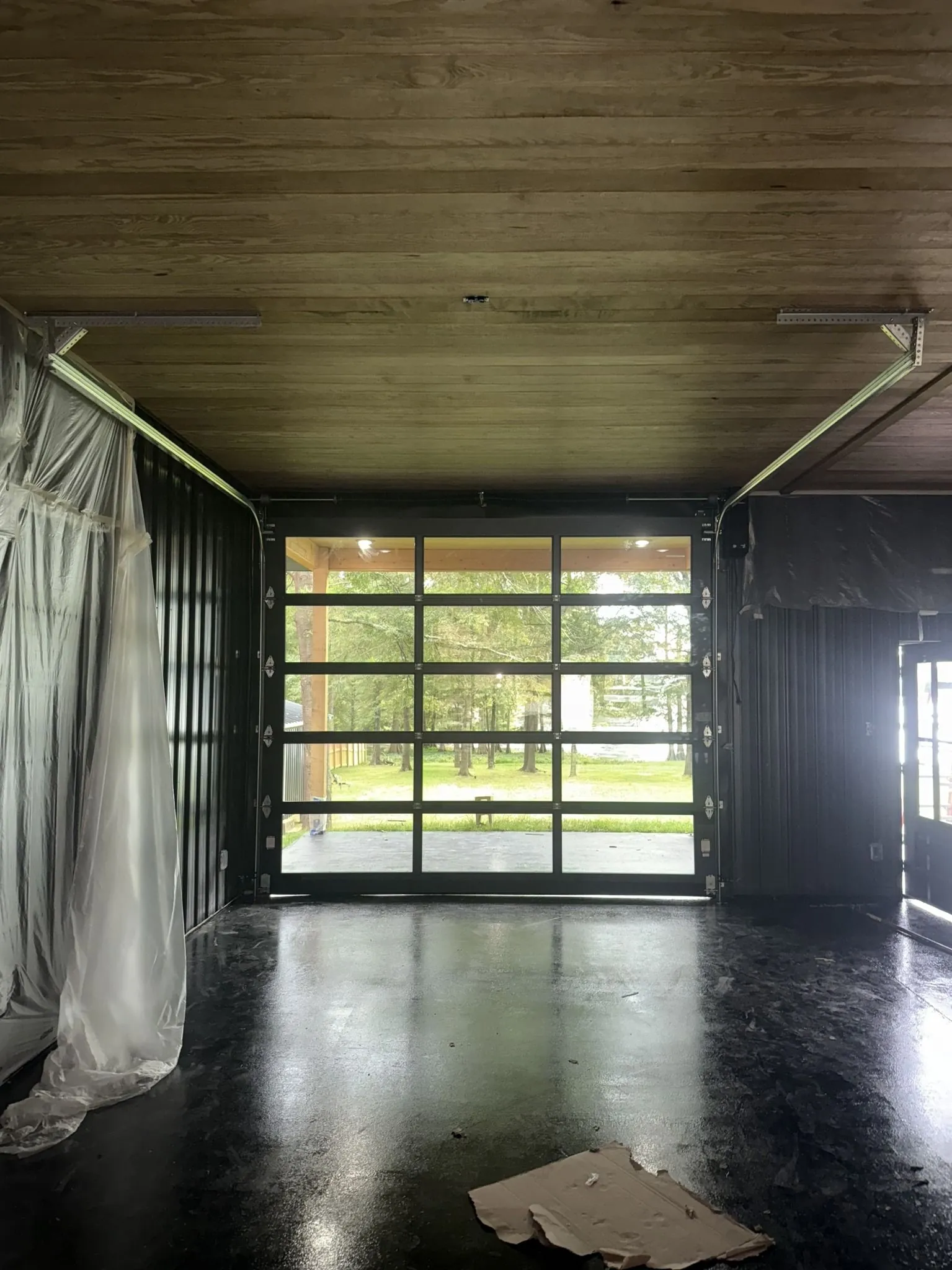 Glass garage door on a shop interior