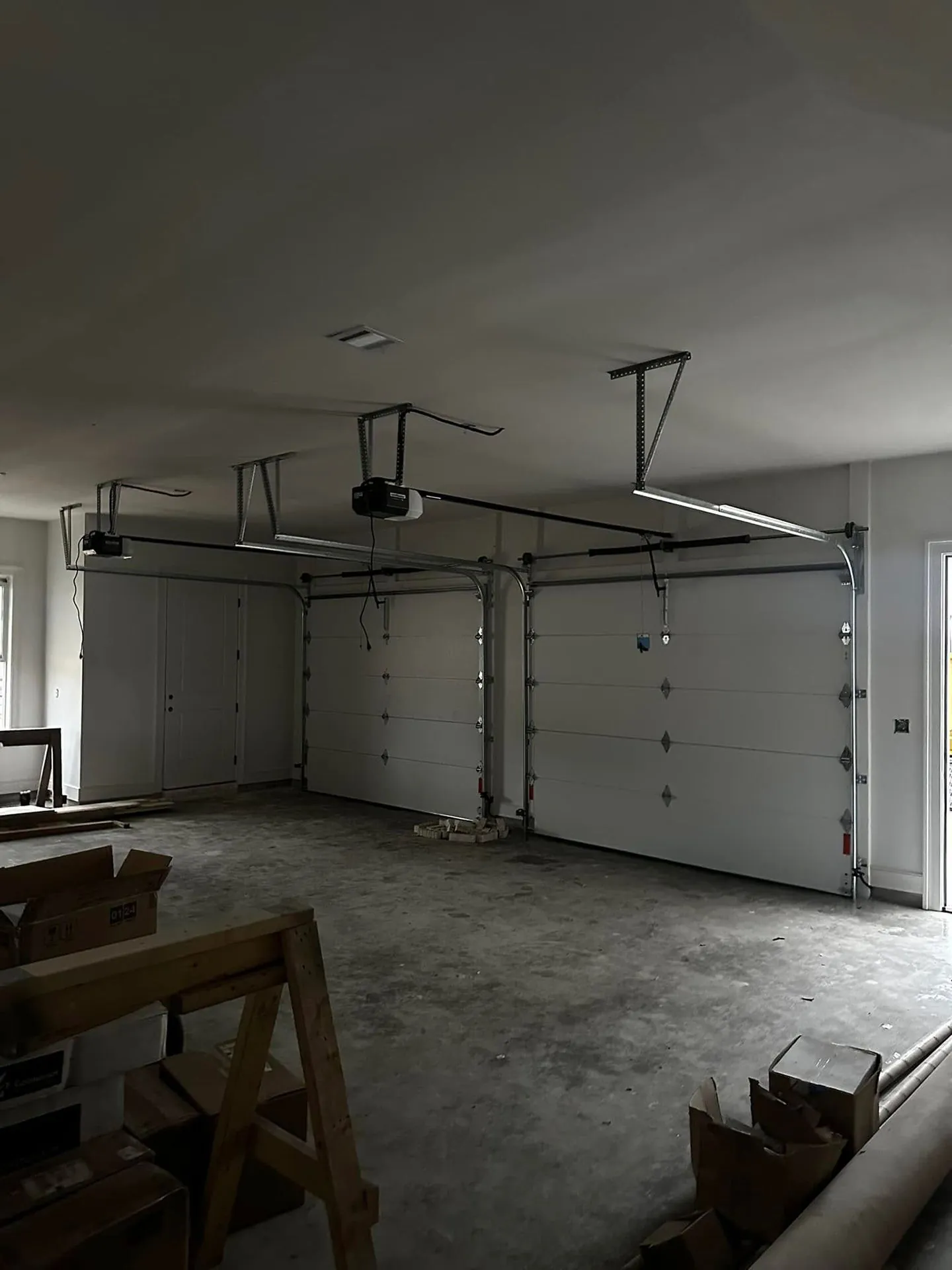 New garage door opener installed on a garage ceiling