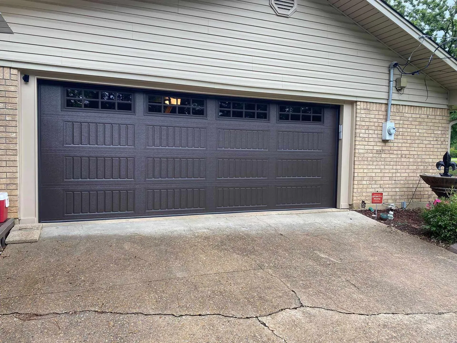Black garage door installed by Geaux Overhead Door